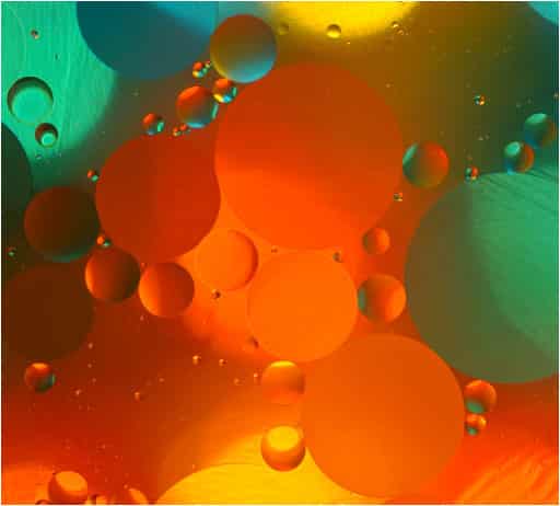 Colorful orange, green, and yellow bubbles creating an abstract